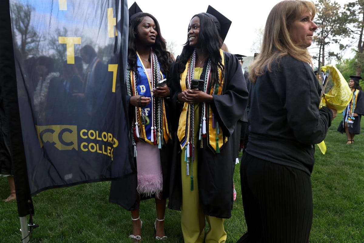 Twins Jessica, left, and Jennifer Aggrey '25, line up for Commencement on May 18 on Tava Quad. Photo by Jamie Cotten / Colorado College