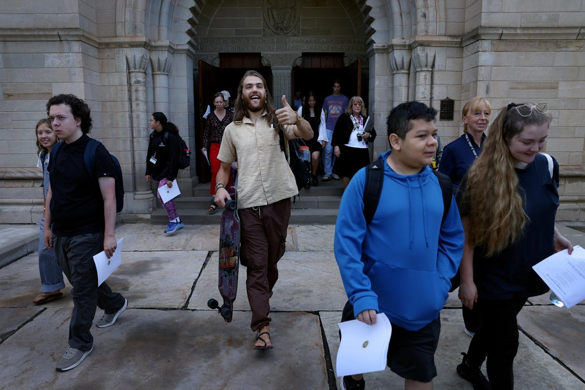 Students, faculty, staff and others leave Shove after Opening Convocation on August 25. Photo By Jamie Cotten / Colorado College