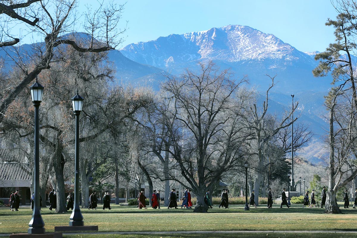Winter graduates and faculty walk to Shove Chapel on Dec. 14 during Winter Commencement 2025. Photo by Jamie Cotten / Colorado College