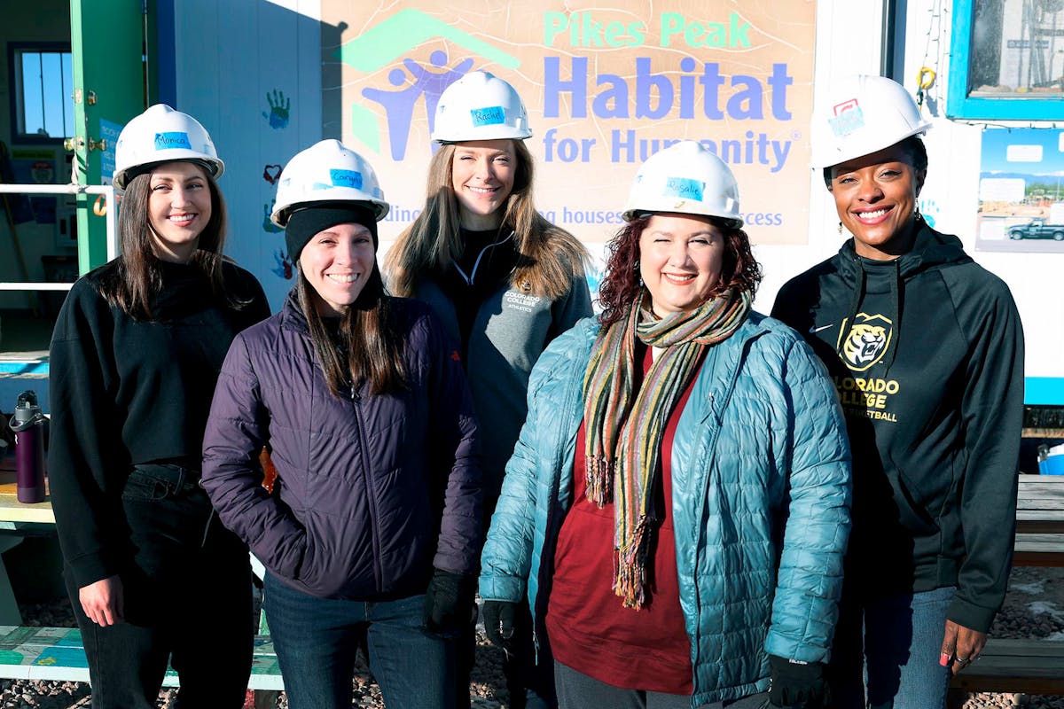  Faculty and staff from the Office of the President volunteer during "Week of Action" at Habitat for Humanity on Jan. 16 at a housing development. Photo by Jamie Cotten / Colorado College