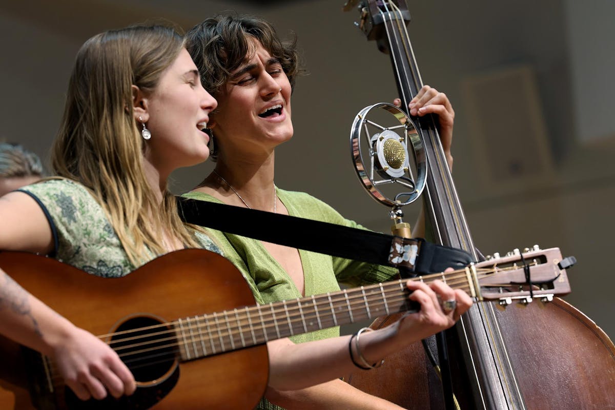 Students Zinnia Voss, guitar, and Maya Mossanen, bass, perform on Feb. 5 during "Music at Midday" at Packard Hall. Music at Midday is once a month, free of charge, and provides both a professional platform for musicians and breath of fresh air to listeners. Photo by Jamie Cotten / Colorado College