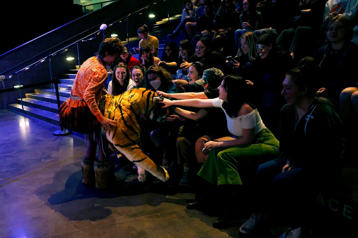 The winner of the Tiger Look-Alike Contest shares the prize on Feb. 7 at Cornerstone during the first annual Tiger Look-Alike Contest. Photo by Jamie Cotten / Colorado College