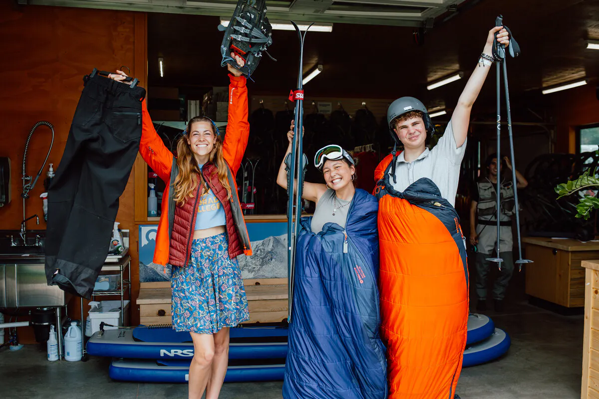 Callie Dickman ’28, Sophia Murphy ’27, and Peyton Kifer ’28 show off some of the outdoor gear available for the CC community to rent from the Ahlberg Gear House. Photo by Meegan Dobson / Colorado College