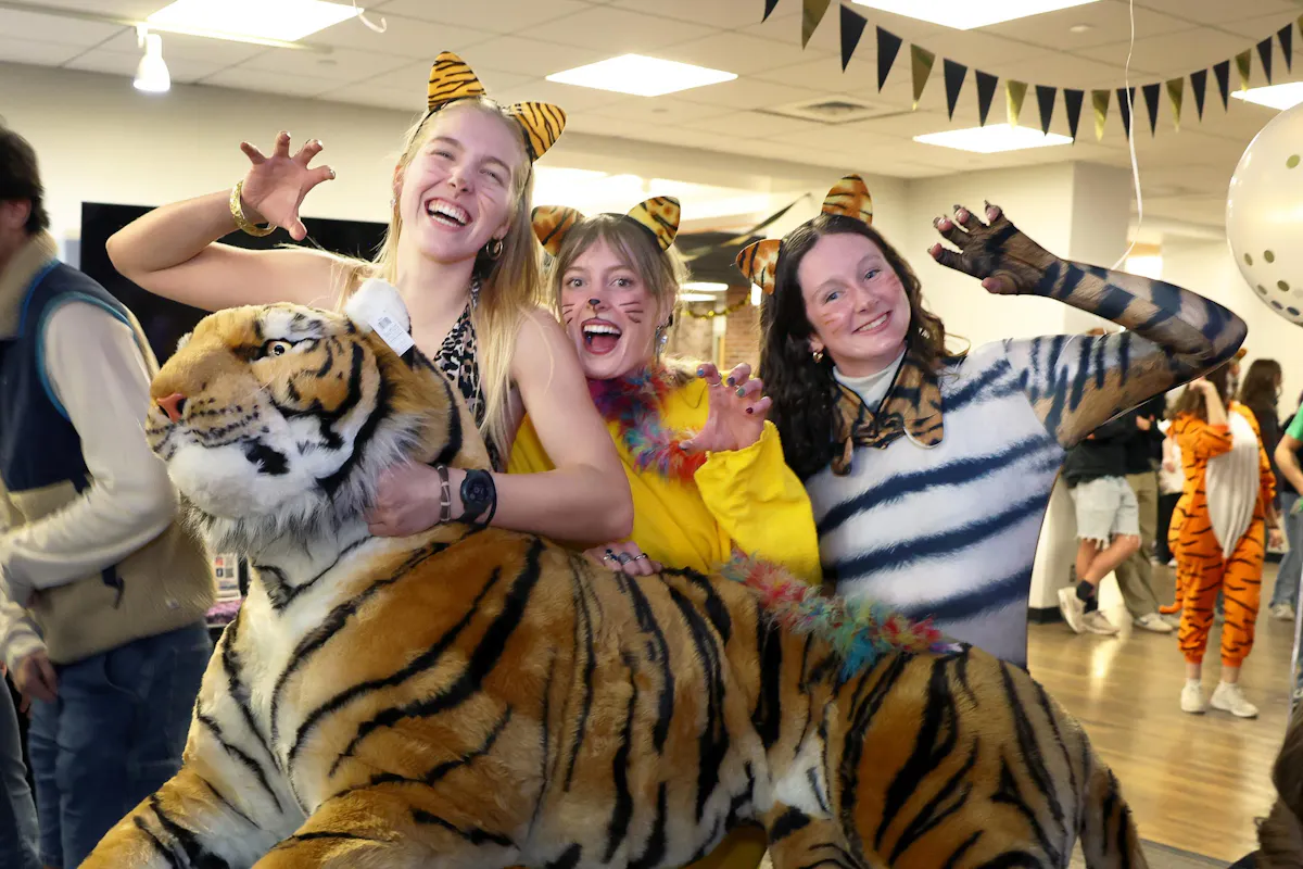 First-place winners of the Tiger Lookalike, Willa McLaughlin ’27, Gabby Marchant ’27, Molly Vance ’27 pose with their prize. Photo by Jamie Cotten / Colorado College